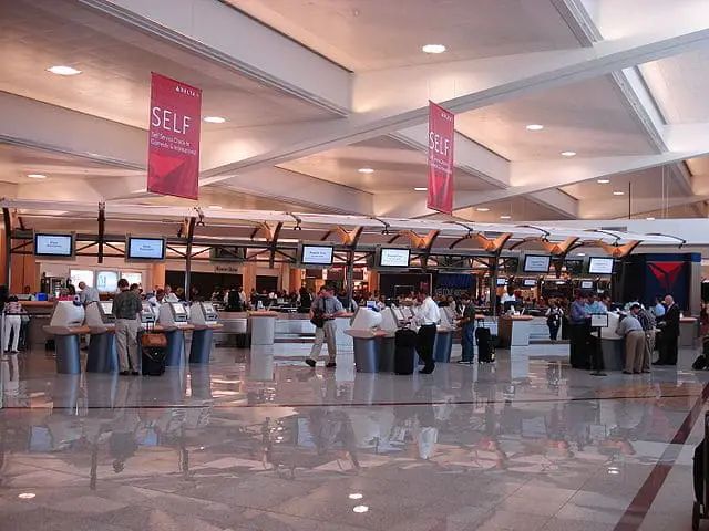 A line of automated and staffed ticketing counters for Delta, Atlanta's major tenant airline